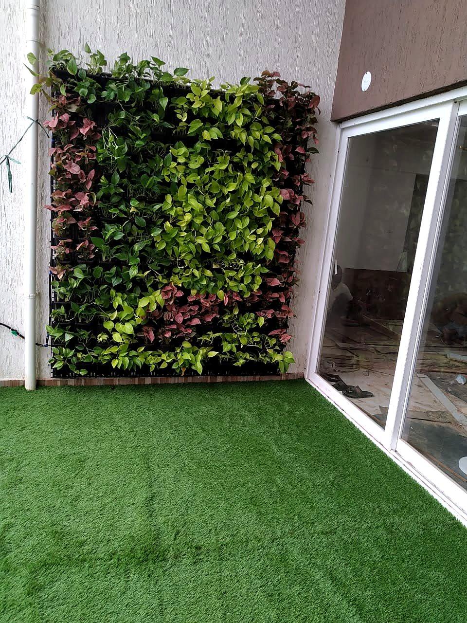 The green wall and turf floor seen from the corner of the balcony